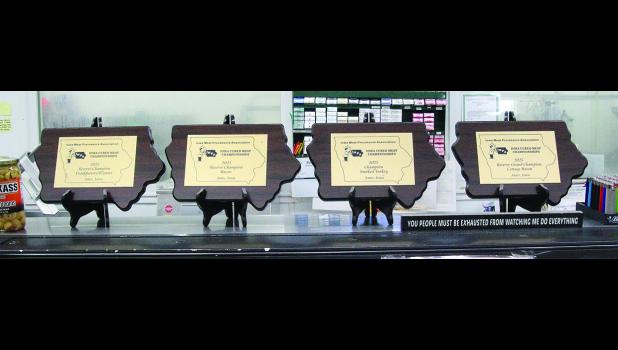 Shown are the four awards on display at the Elma Locker & Grocery facility in Elma.
