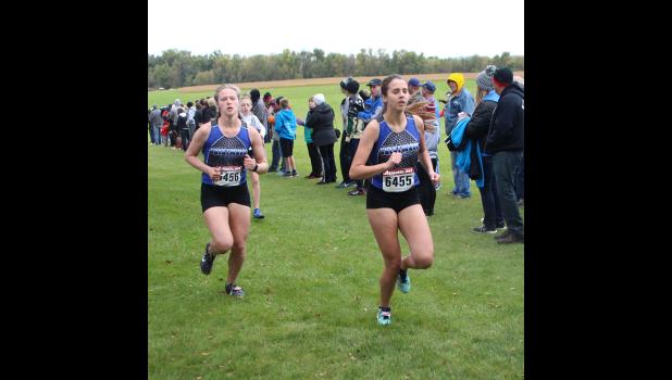 Annie Mast, left, and Sarah Mashek compete during a recent meet.