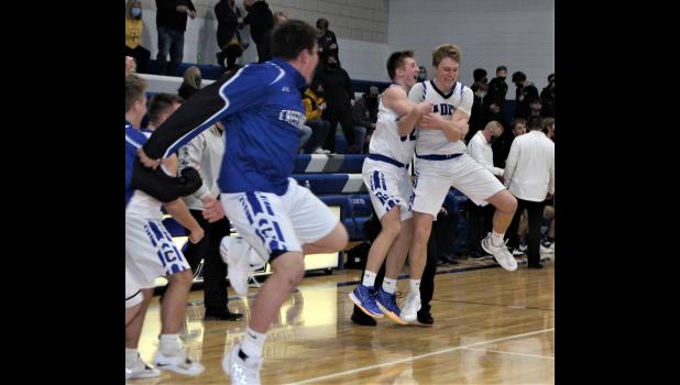 Crestwood players Landon Simiele and Carter Henry celebrate the Cadets' win over Waverly-SR on Jan. 29.