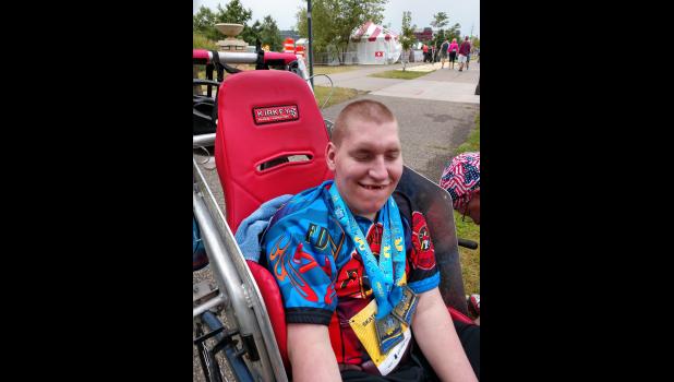 Logan Knecht proudly wears the finisher medals from the 2018 NorthShore In-Line Skating Marathon in Duluth.