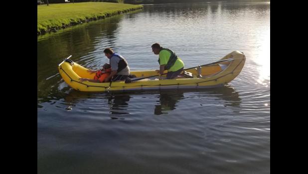 Cresco Community Fire Department members perform some rescue training with their new boat. Two firefighters and two victims can fit in the vessel. Shown are two rescuers and one victim.