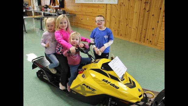Enjoying Snowfest are L-R: Ella, Nora and Mara Gooder with friend Rhett Plaht.