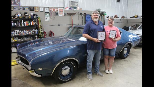 Mark and Jean Hover of Cresco are shown in front of their 1969 Olds 442 sports coupe, which won “Best of Show” in their class at the Oldsmobile Club of America National Car Show in Bowling Green, Kentucky.