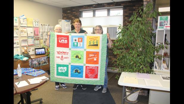 Gladie Church, Sharla Fencl and Marge Johnson worked together to sew this quilt, with matching pillow case, made from years of 4-H Farm Safety t-shirts. It will be on the silent auction in the 4-H building during the Mighty Howard County Fair.
